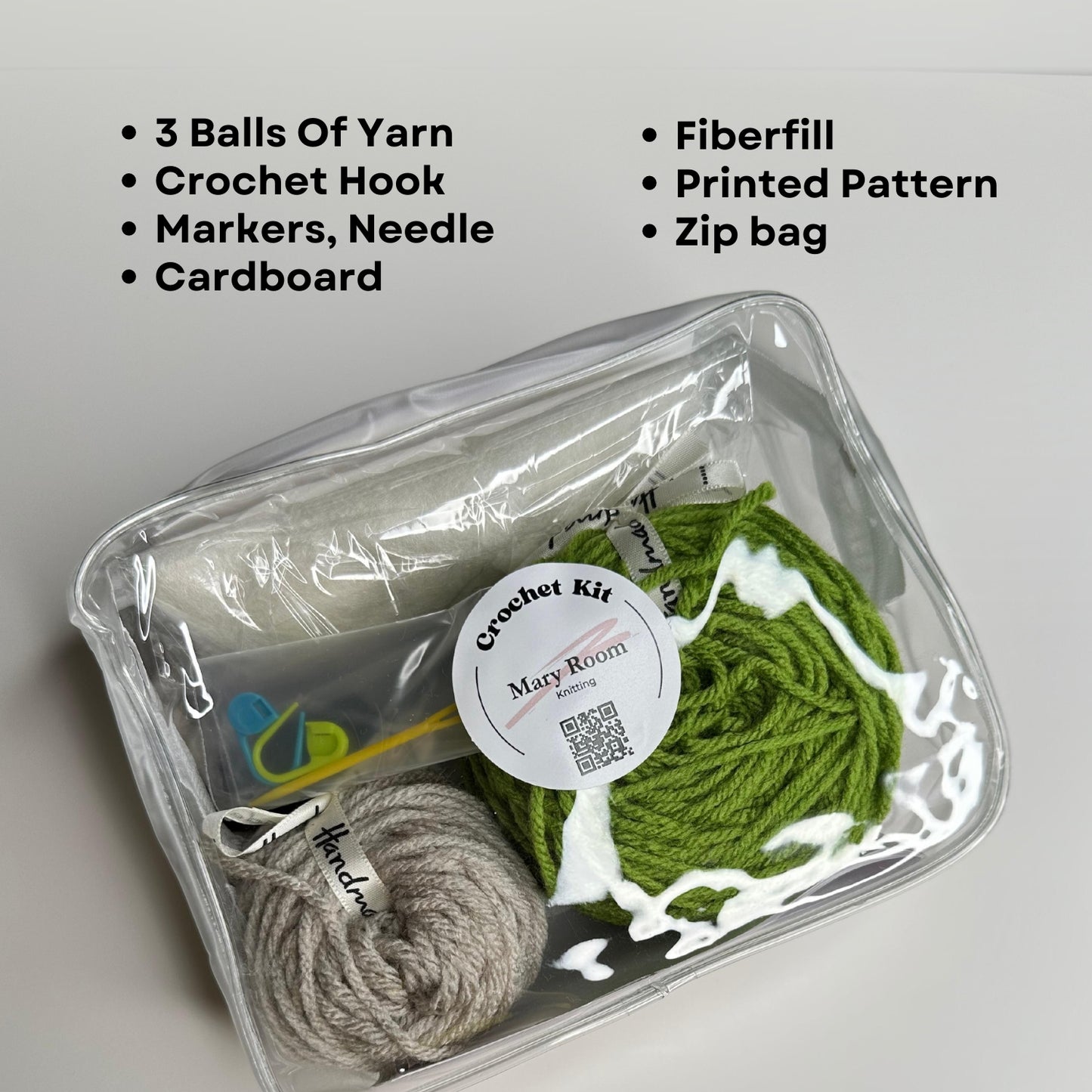 Complete crochet kit in clear zippered bag with yarn, tools, and printed pattern