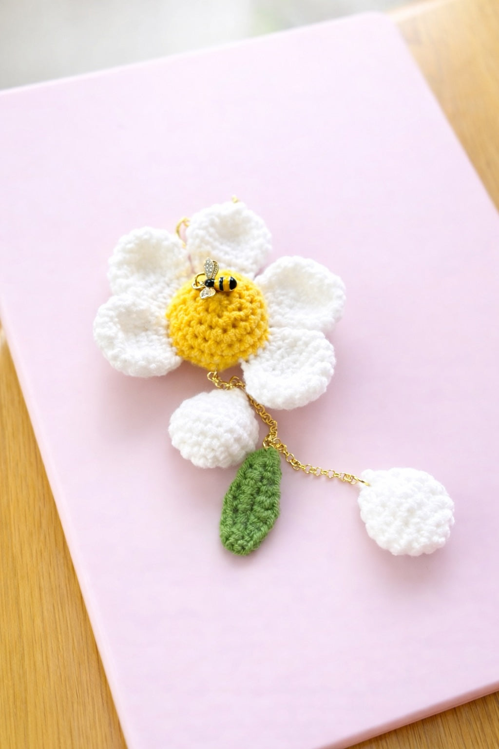 Crochet flower keychain for purse or backpack, daisy charm with bee and pom pom details
