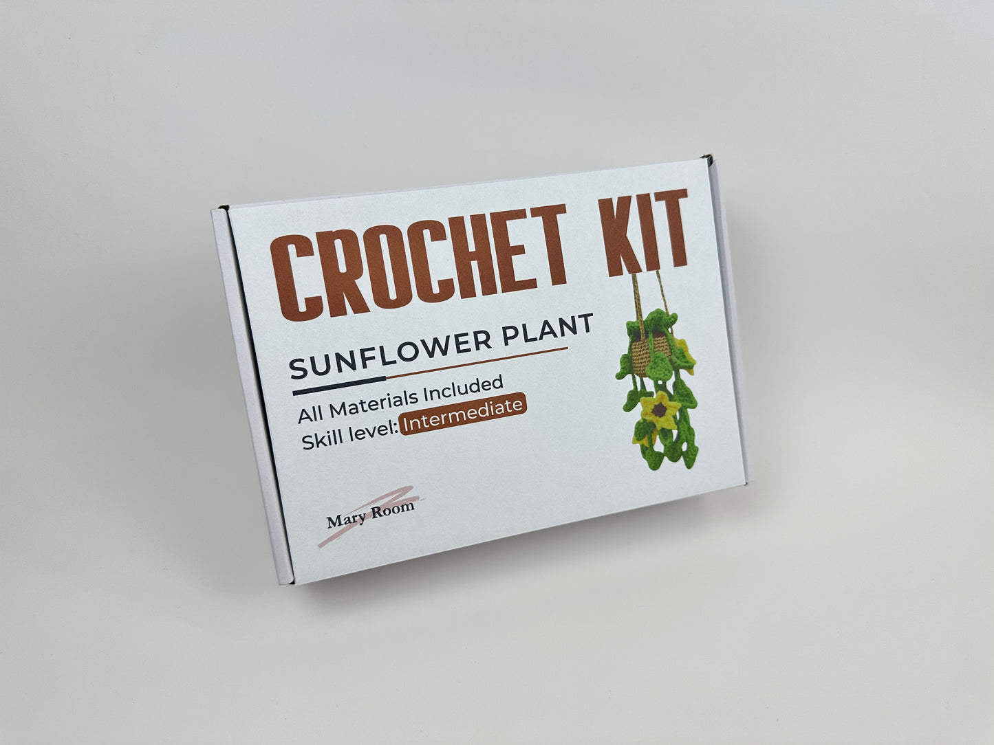Sunflower amigurumi kit with instructions and materials for making a crochet plant