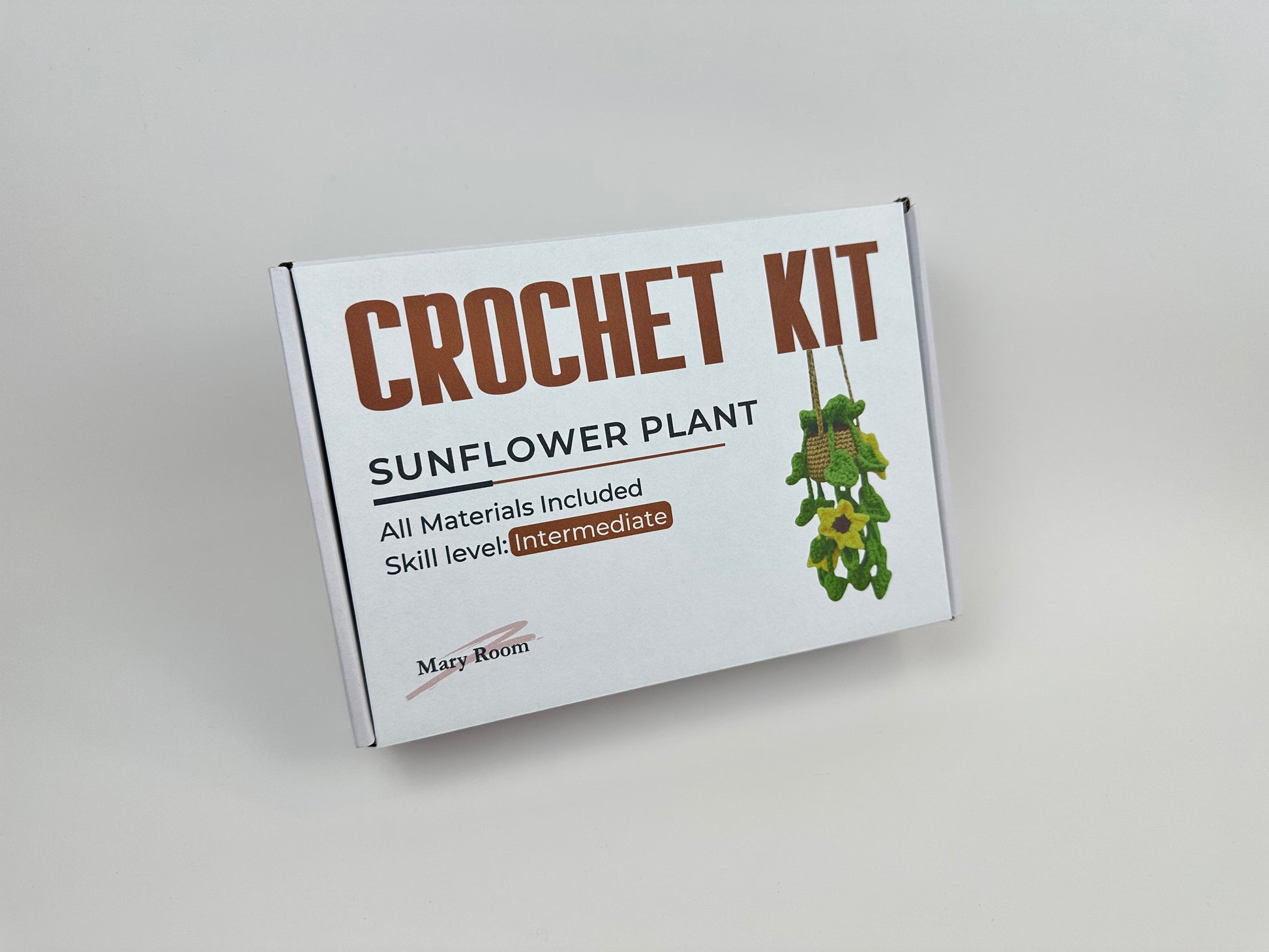 Sunflower amigurumi kit with instructions and materials for making a crochet plant
