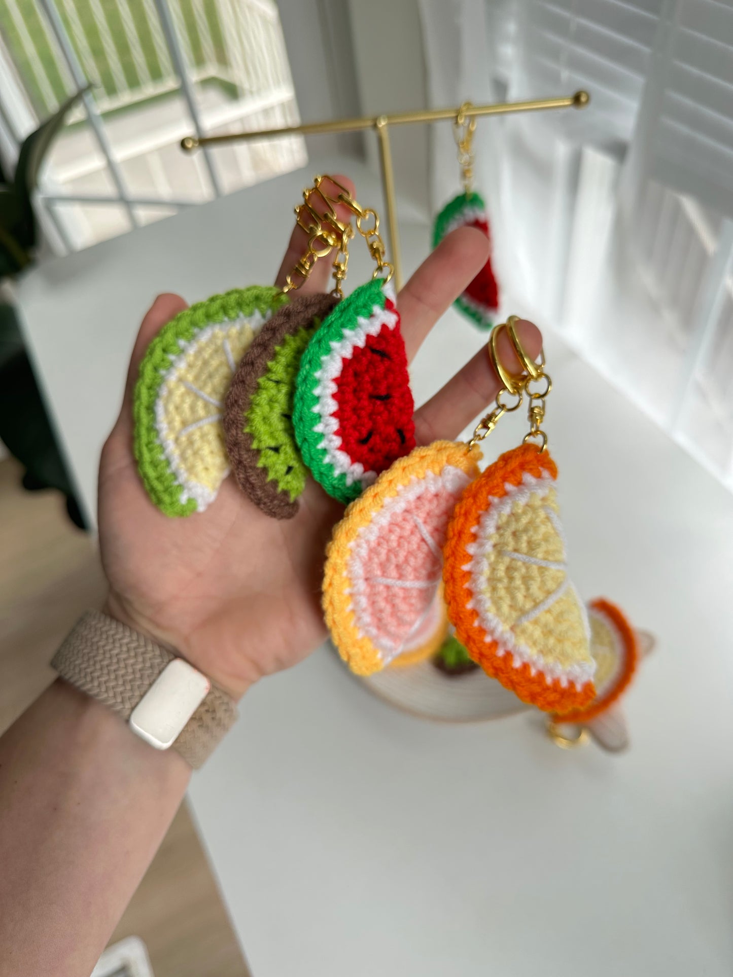Colorful fruit slice crochet accessories made with soft acrylic yarn
