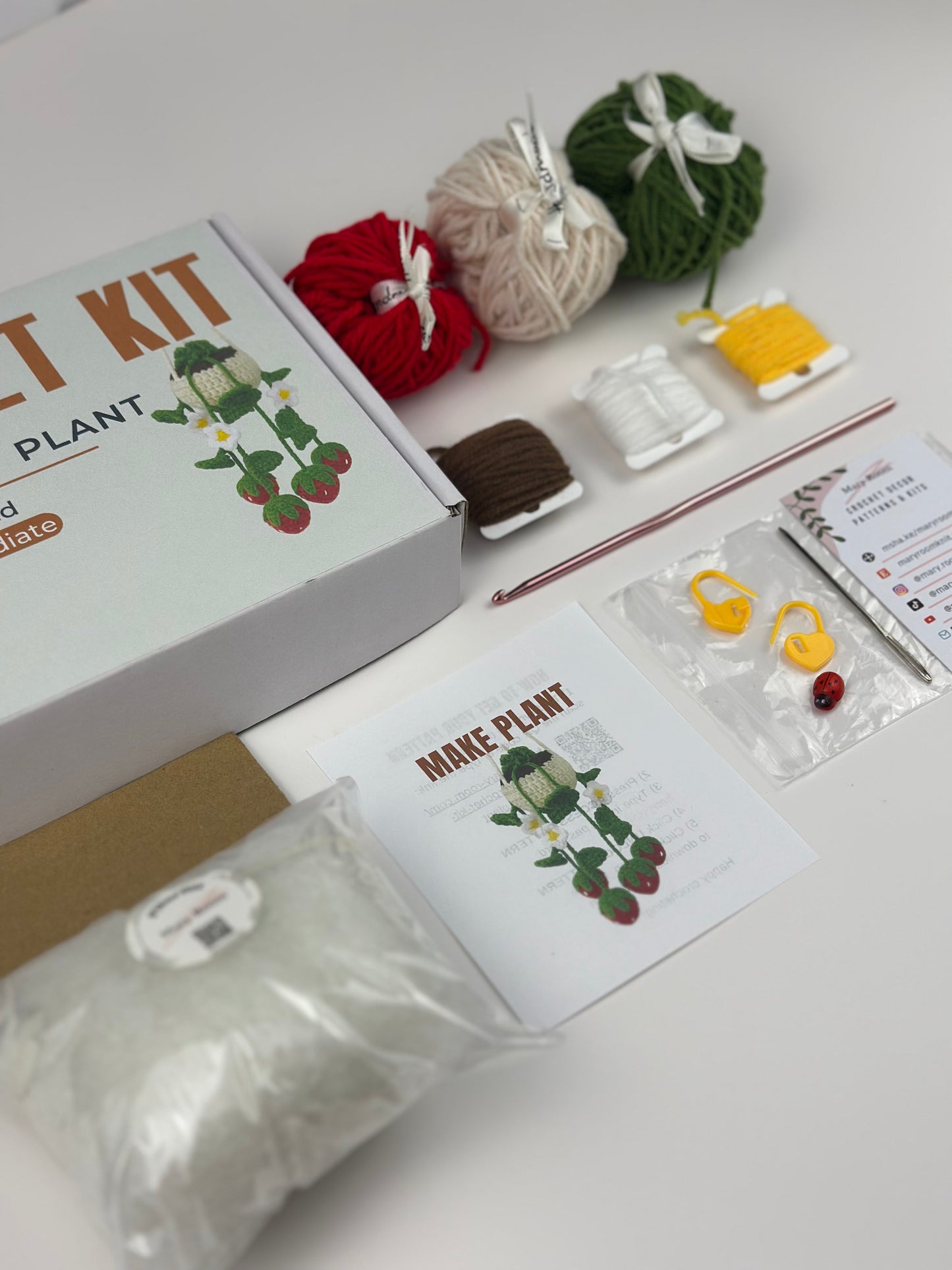 Craft crochet DIY kit with yarn balls, tools, and instructions how to make a hanging plant
