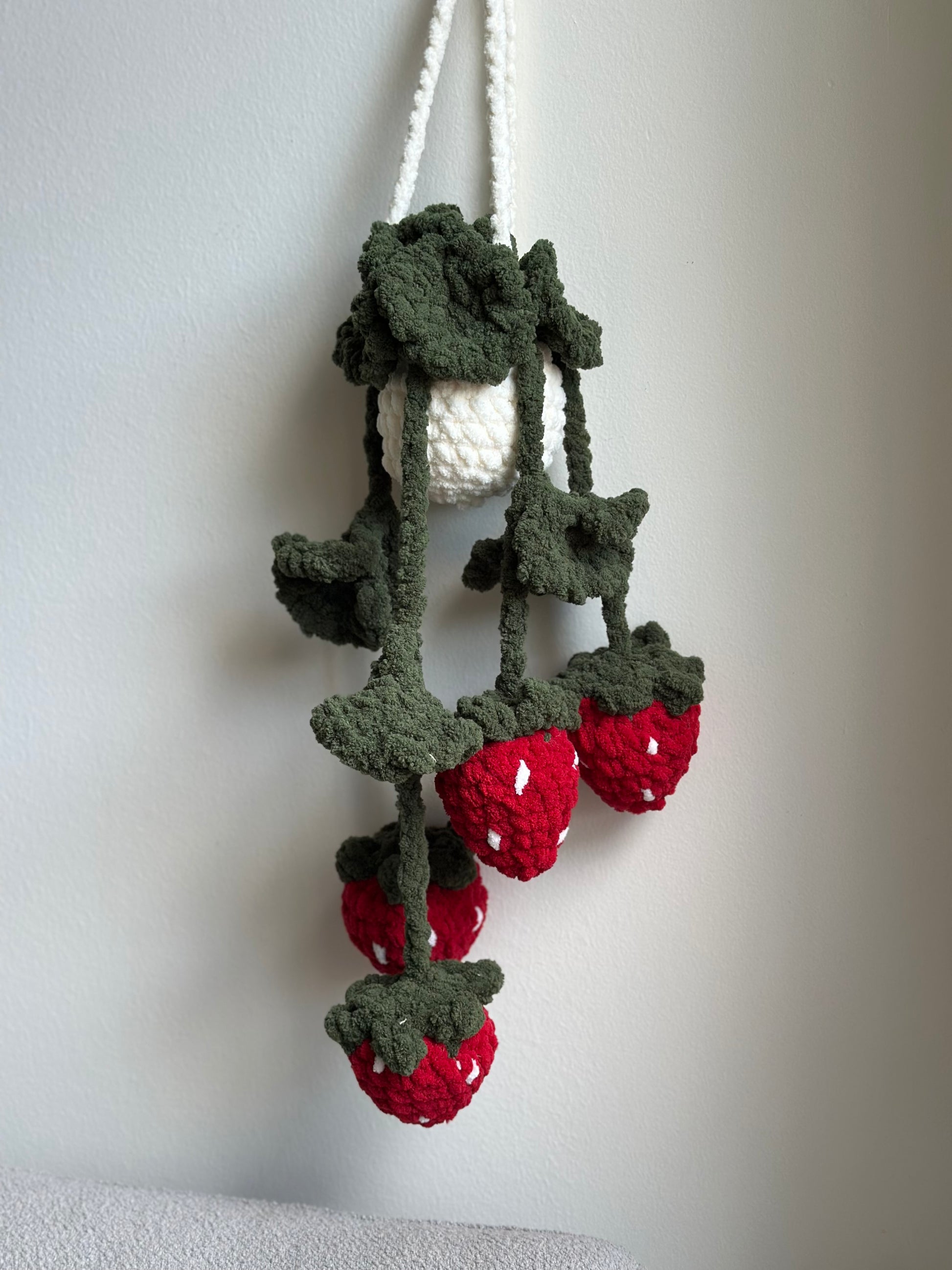 Crochet hanging strawberry plant with soft plush yarn and green vines