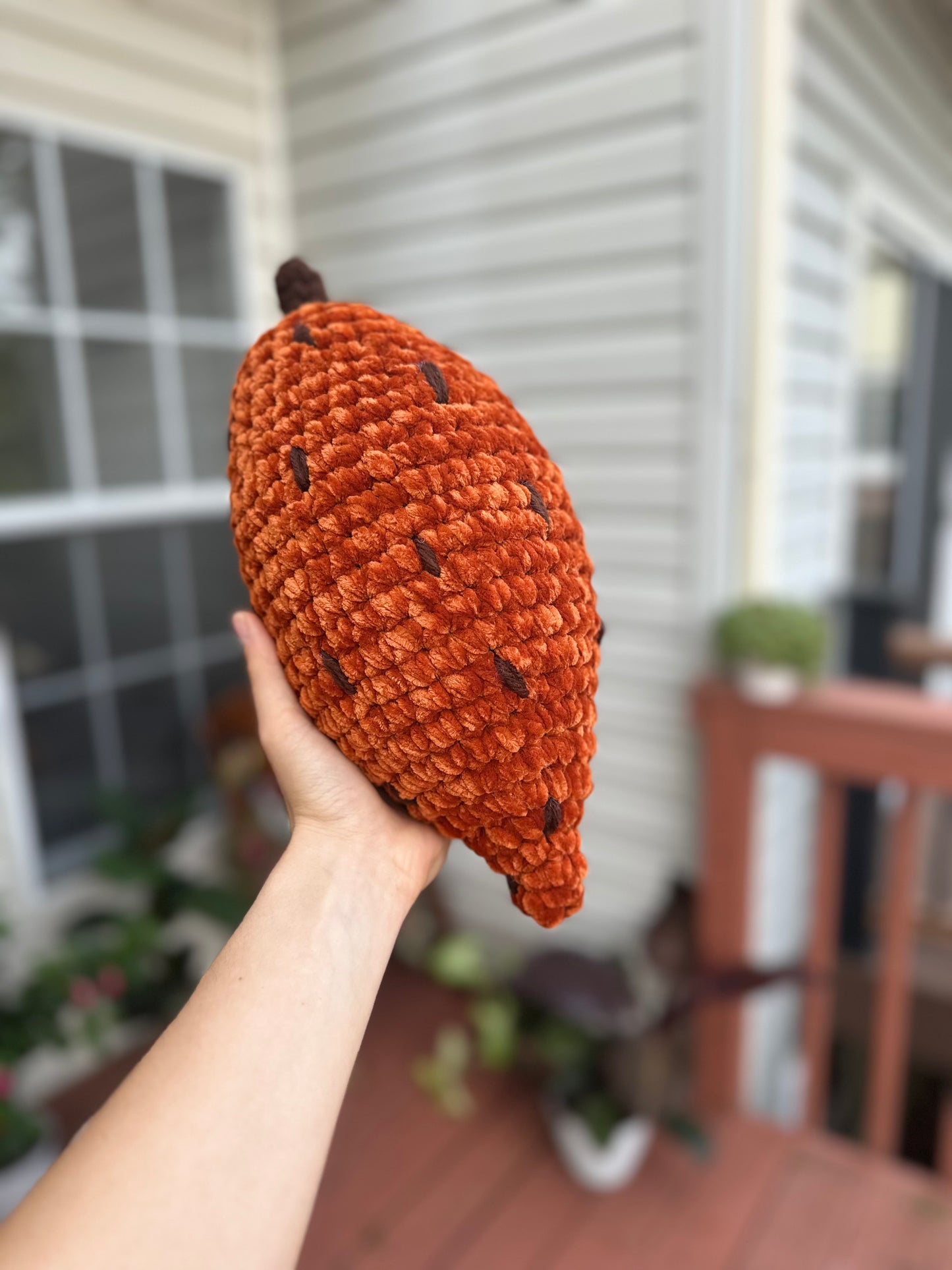 Handcrafted crochet sweet potato stuffed toy with cozy plush yarn texture