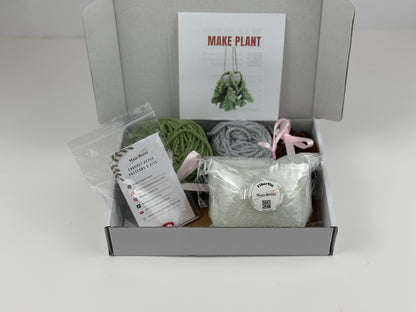 Complete crochet kit for making a realistic fern plant with yarn, hook, stuffing, and tools