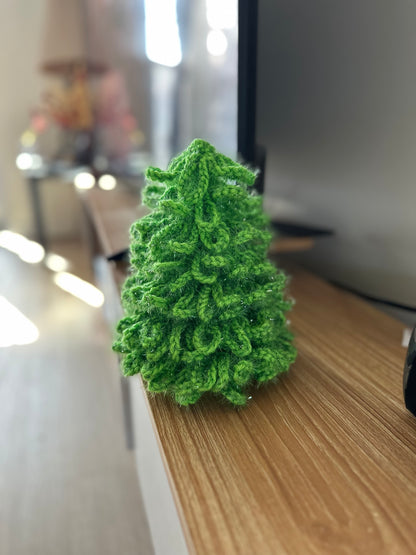 Crochet Christmas decor tree crafted from glossy green yarn with fluffy texture and shimmer