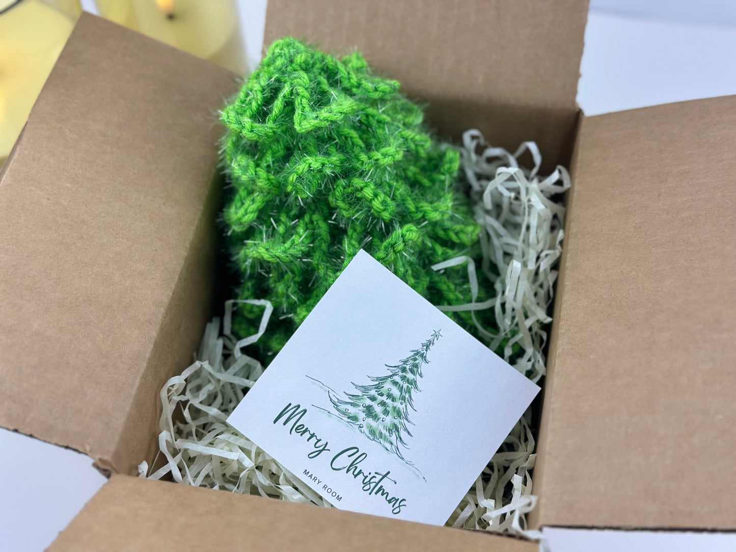 Christmas tree ornament decor in a gift box with Merry Christmas card