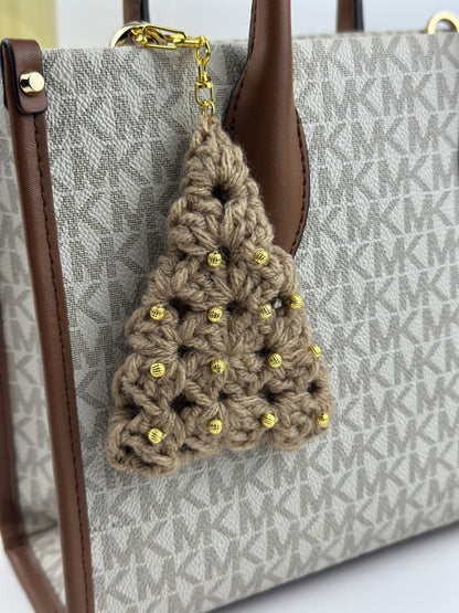 Soft plush Christmas tree keychain hanging on a bag