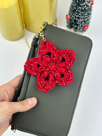 Crochet star ornament keychain for Christmas gifts, shown in beige yarn with a simple cozy design