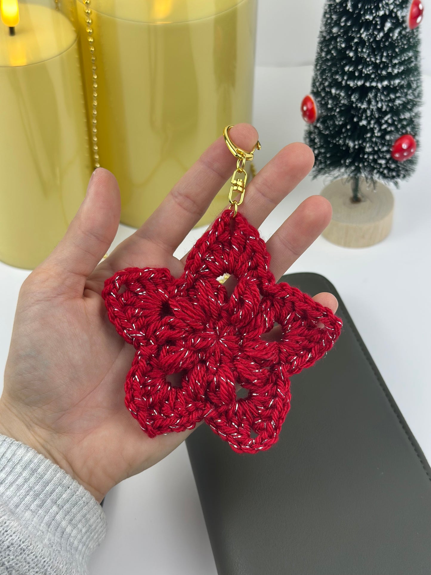 Festive crochet star keychain made from soft acrylic yarn, perfect stocking stuffer idea