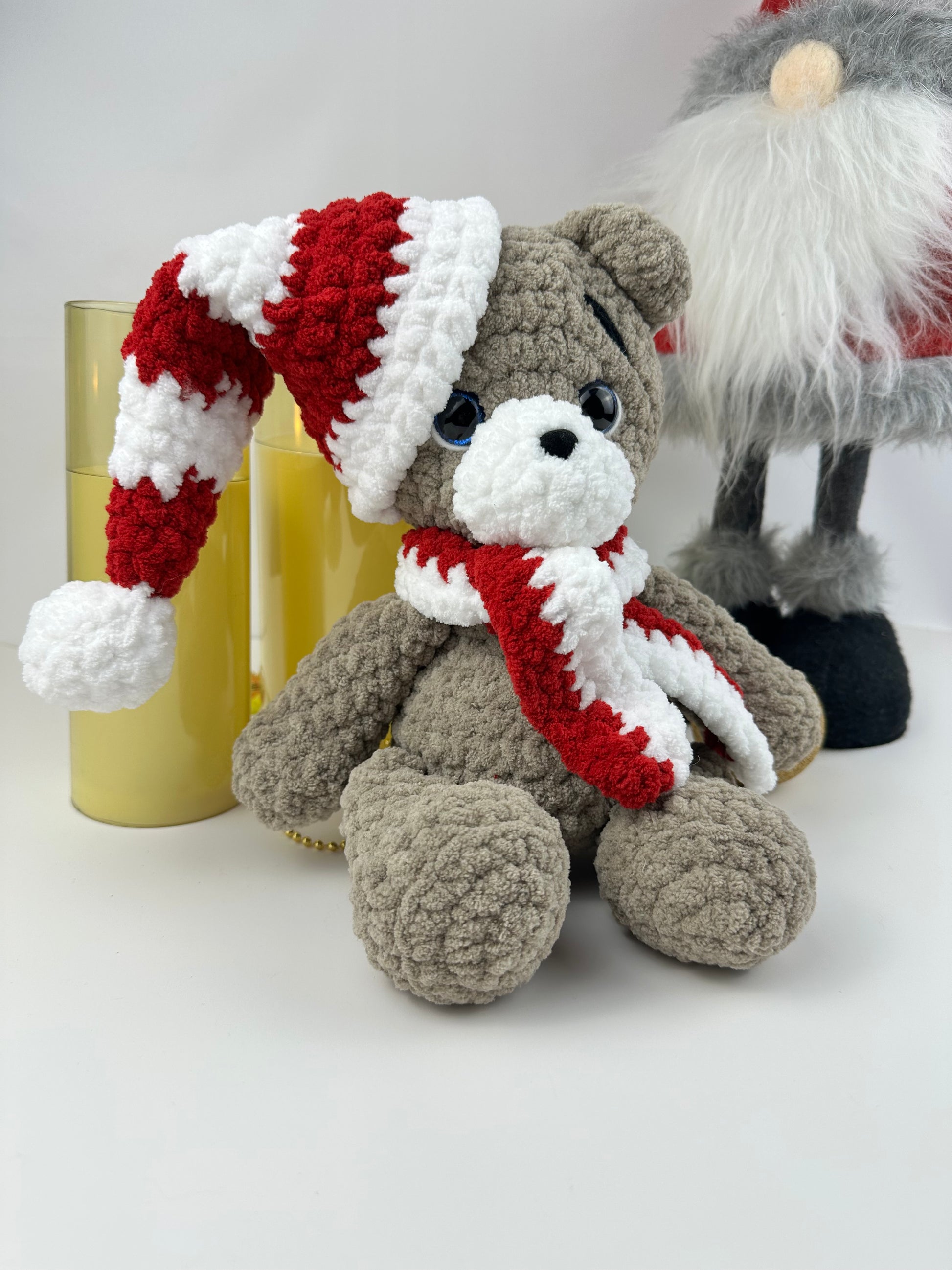 Cute handmade Christmas teddy bear decor with crochet hat and scarf, perfect for holiday gifts.