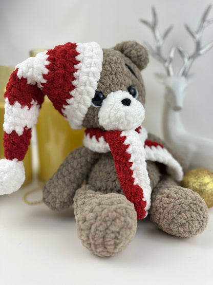 Soft plush crochet bear dressed in festive red and white, ideal for Christmas home decoration.