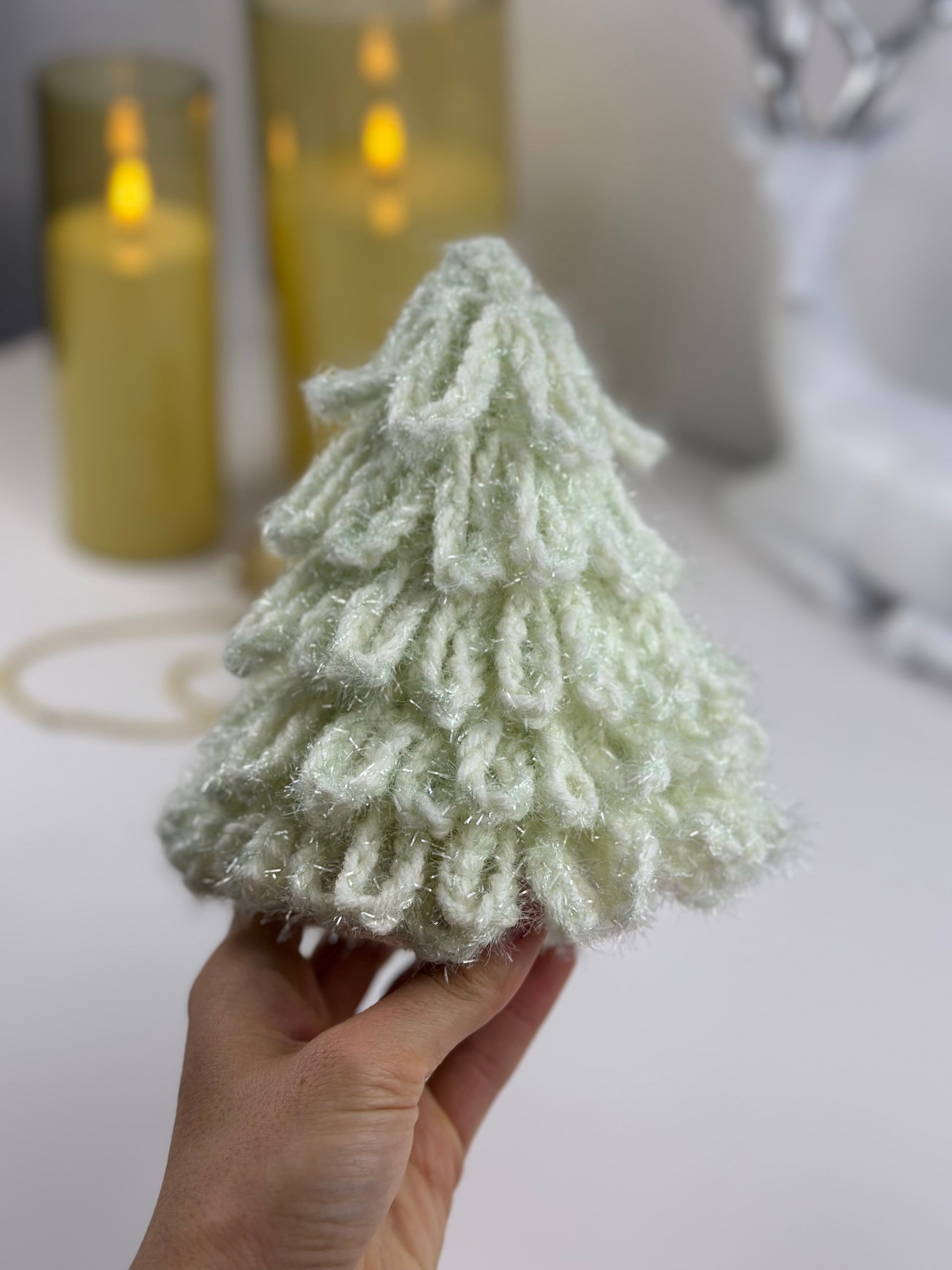 Handmade crochet holiday tree with delicate loop stitches and fluffy texture.
