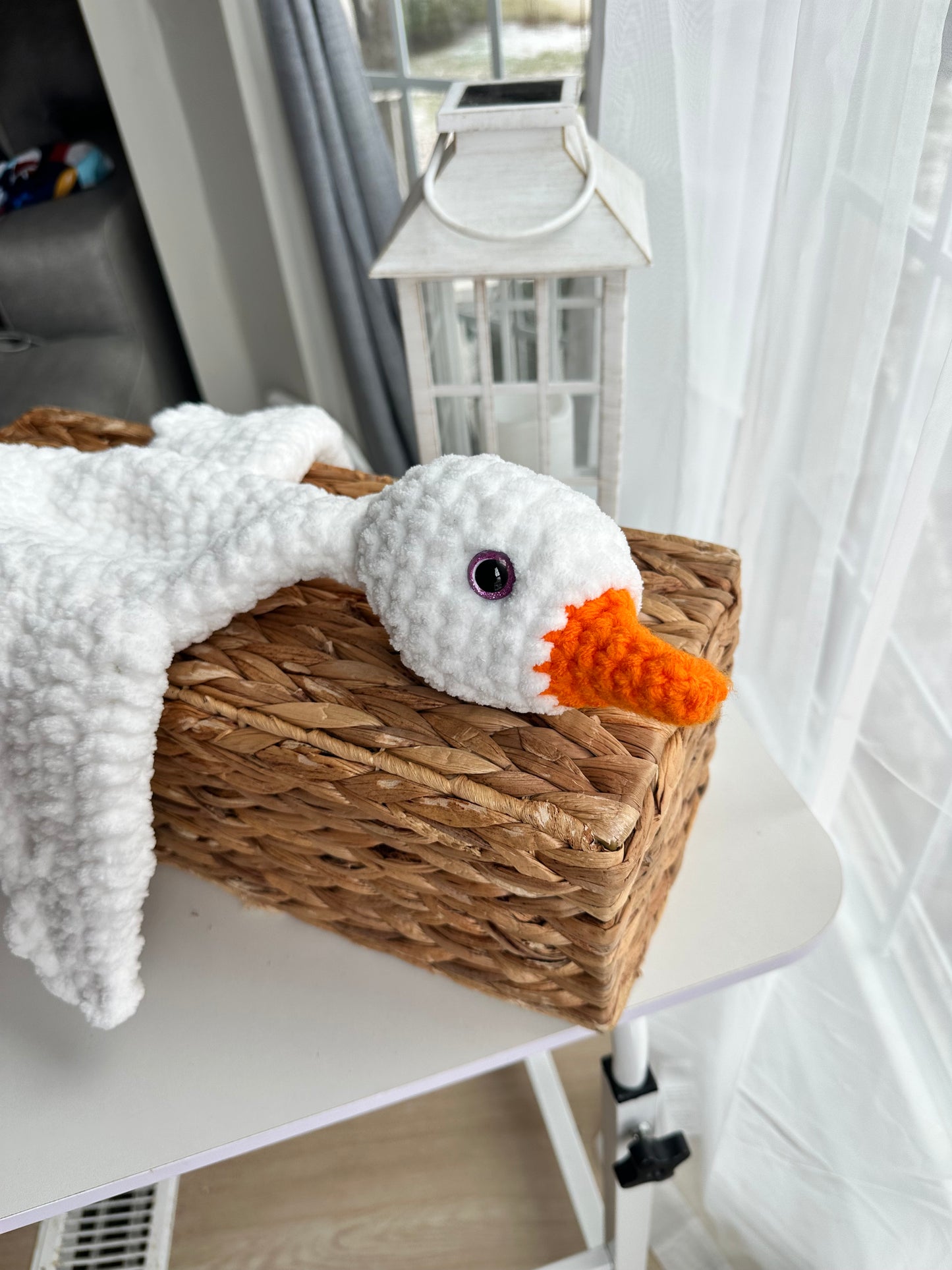 Crochet goose plush with plastic safety eyes securely attached