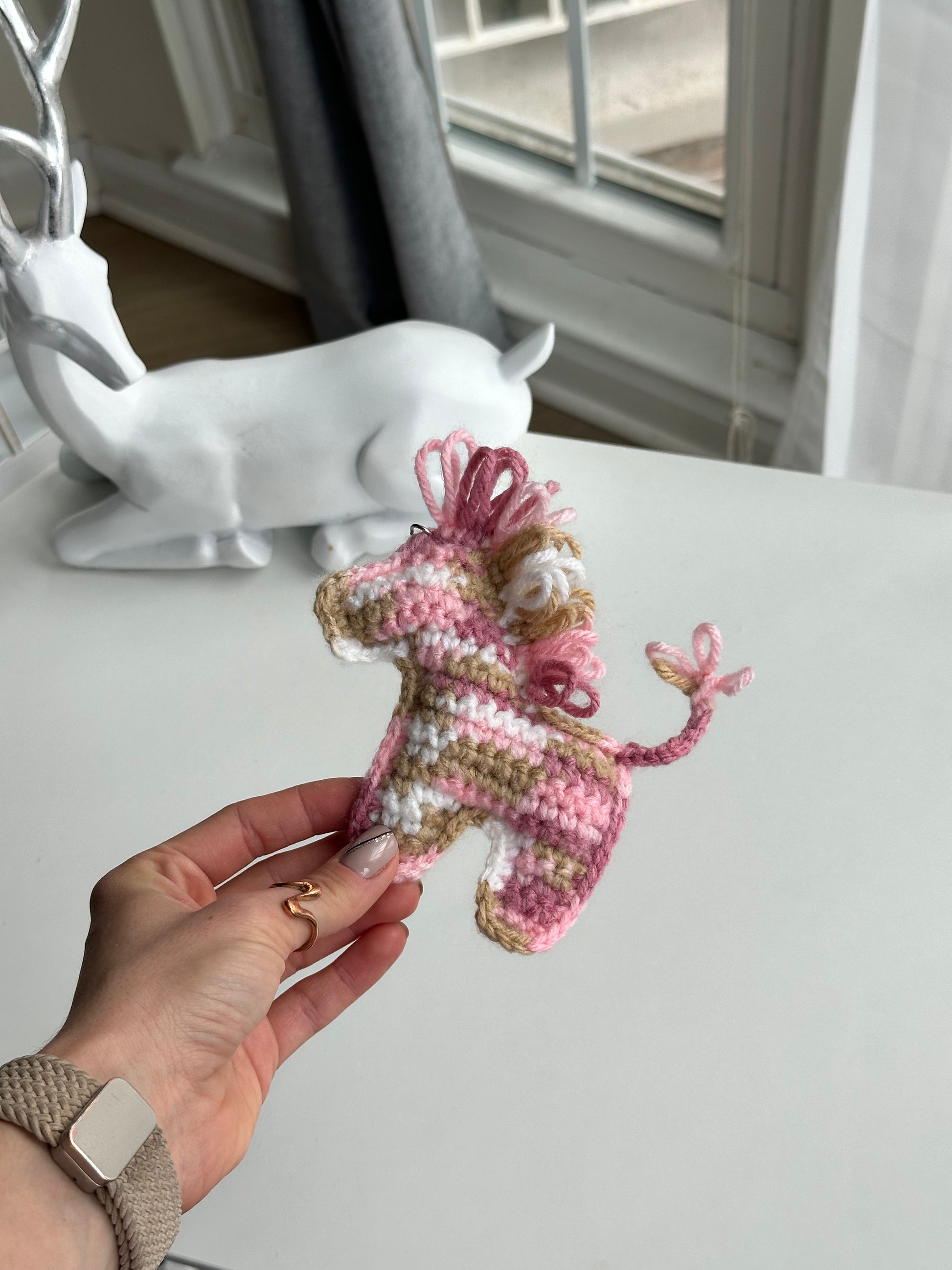 Handmade multicolor crochet horse keychain with metal clasp, cute amigurumi accessory for bags and keys