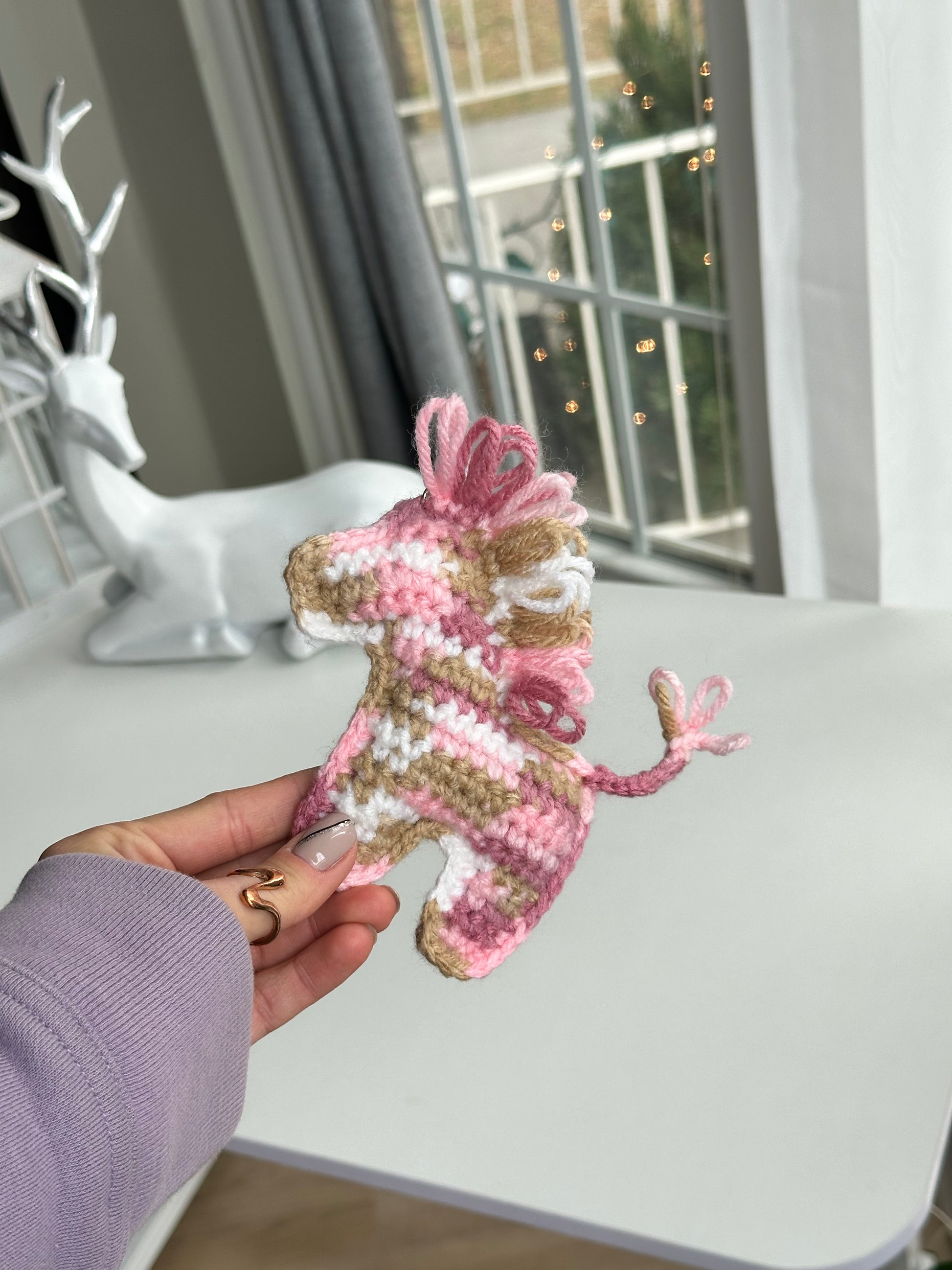 Cute crochet pony keychain with bright yarn colors, handmade accessory for everyday carry
