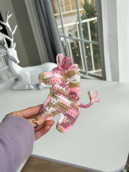 Cute crochet pony keychain with bright yarn colors, handmade accessory for everyday carry