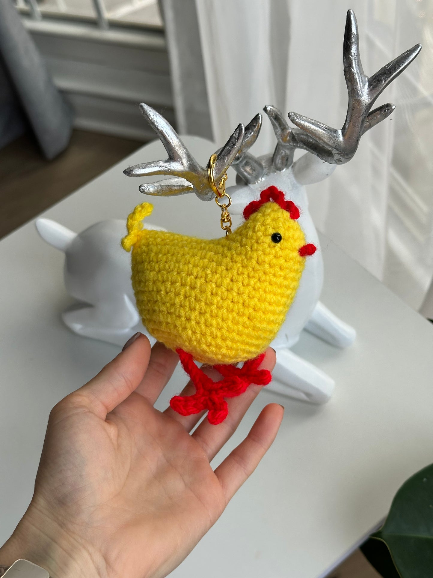 Crochet chicken plush keychain with plastic safety eyes and fiberfill stuffing
