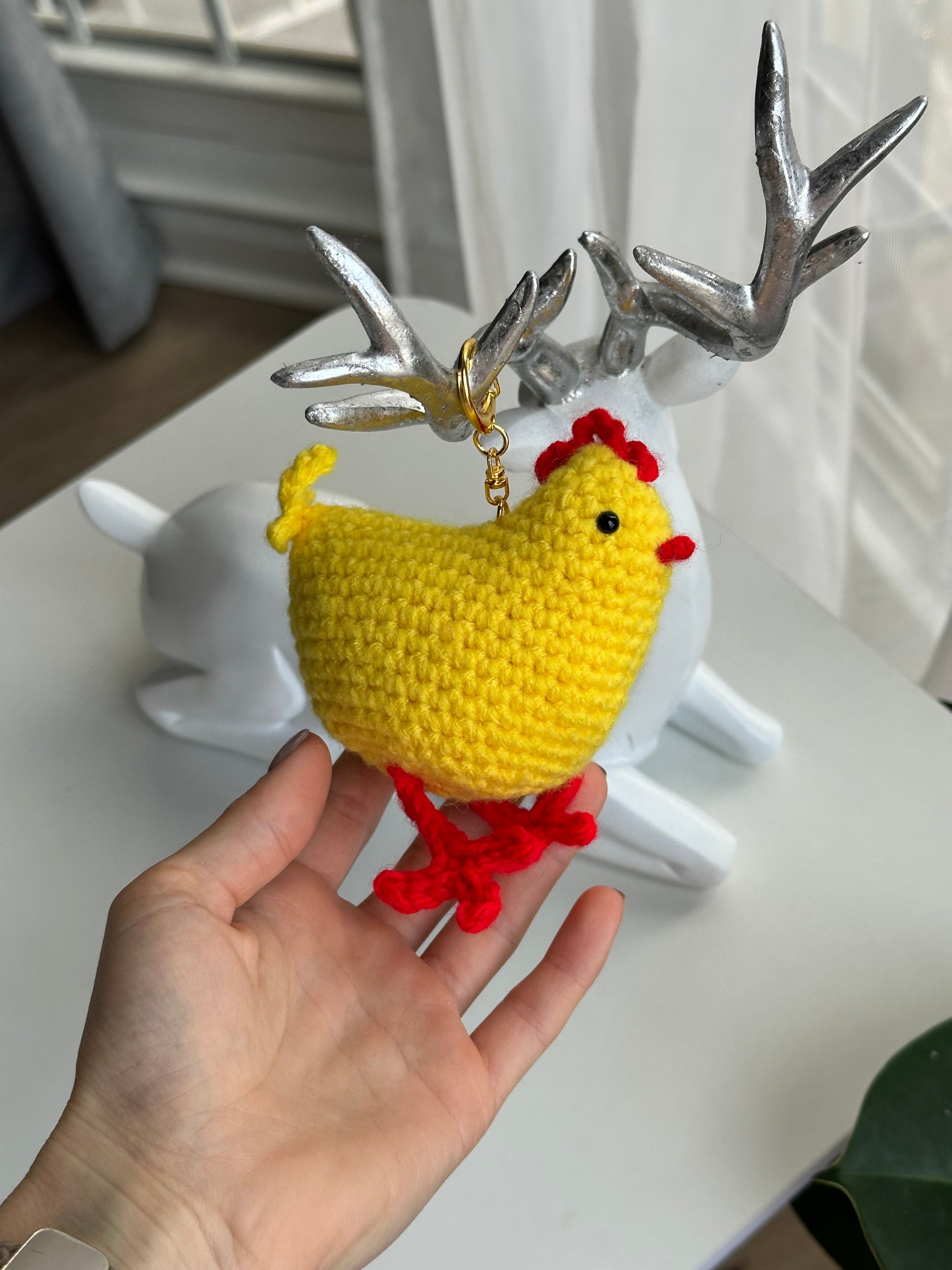Crochet chicken plush keychain with plastic safety eyes and fiberfill stuffing