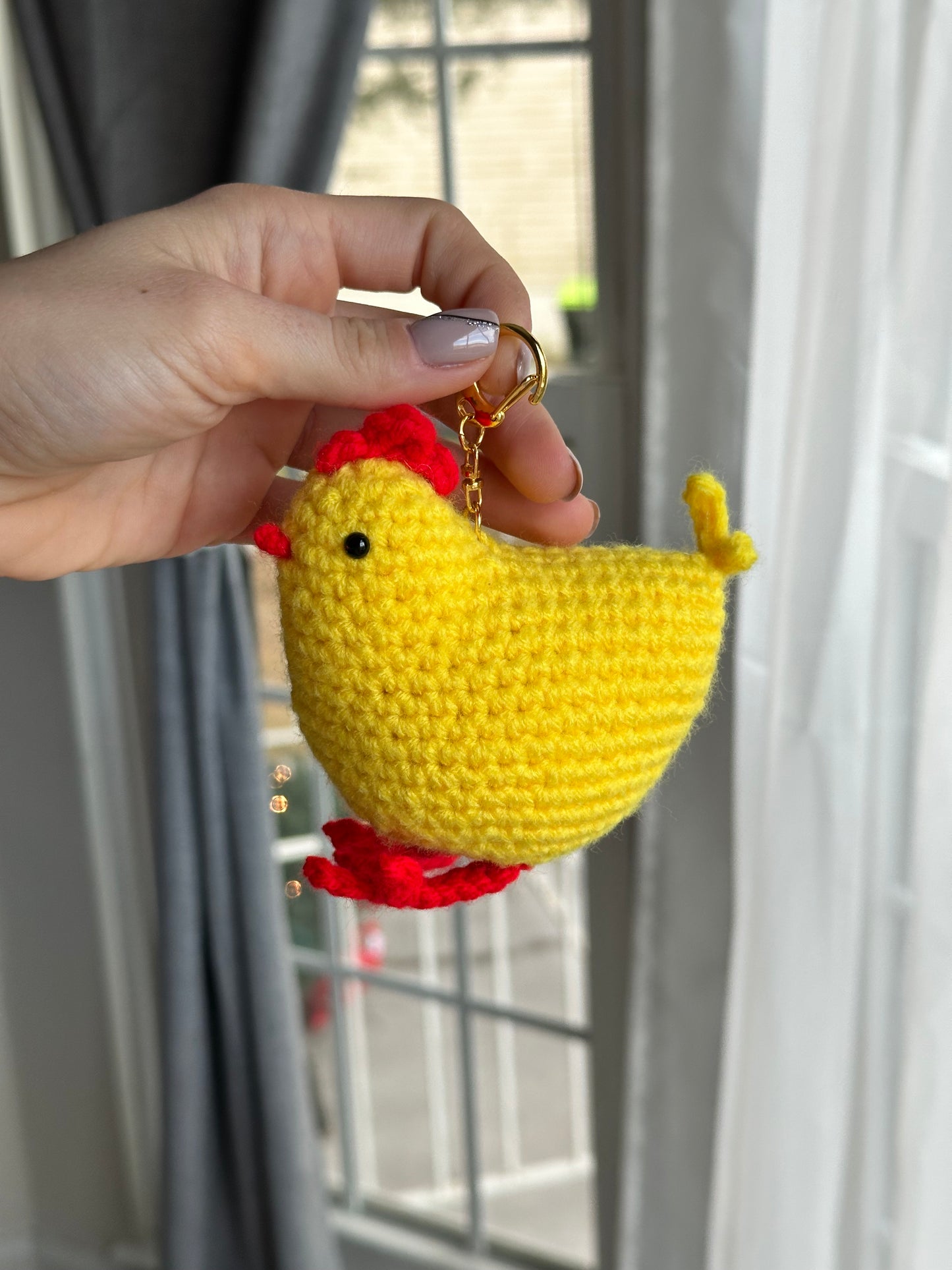 Close-up of soft acrylic yarn texture on crochet chicken keychain