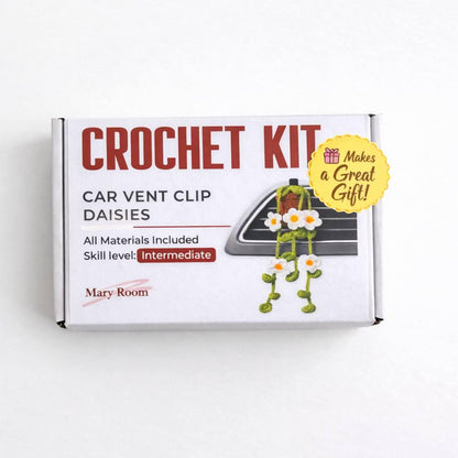 Closed packaging box crochet kit labeled “Car Vent Clip – Daisies” with yellow gift sticker. step-by-step crochet pattern tutorial, crochet diy kit