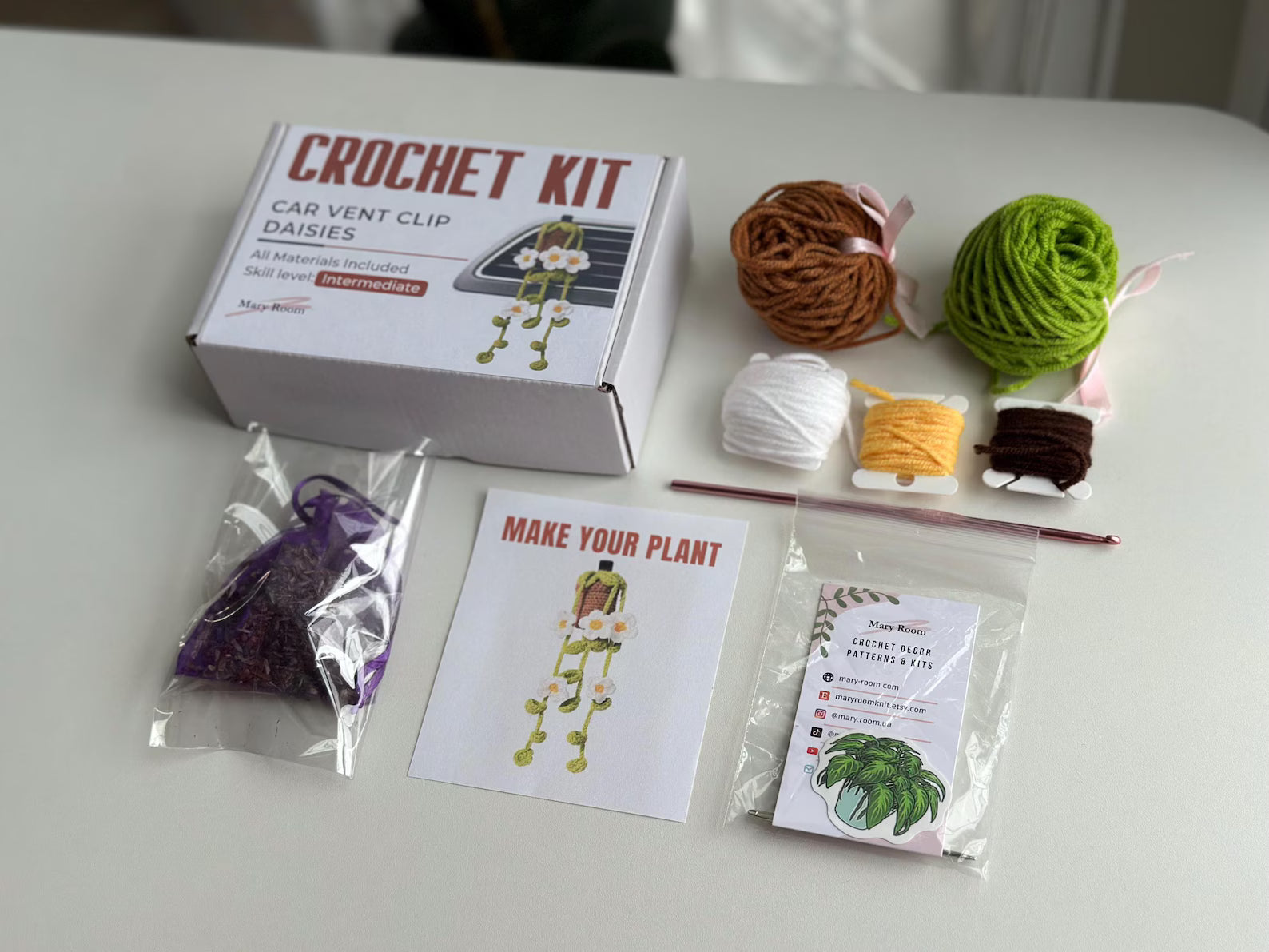 Closed crochet kit box with daisy label and gift-ready sticker